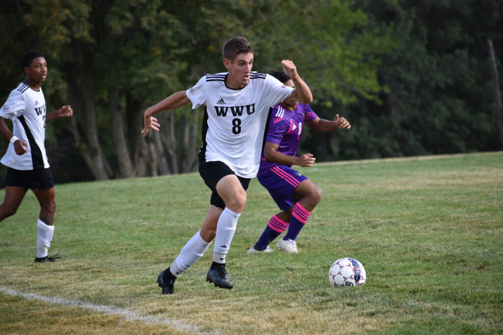 Soccer player running on field