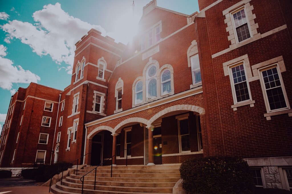 Sun shining over Dulany Auditorium entrance.